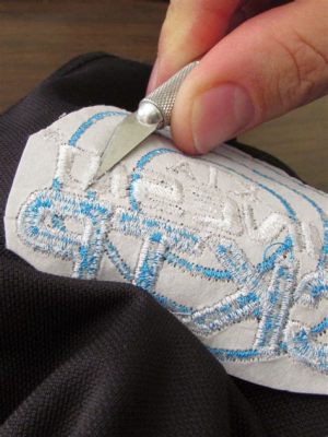 can you remove embroidery from a shirt while preserving the integrity of the design?